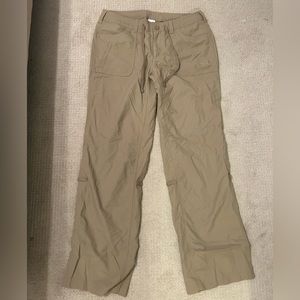 North face light weight tan/khaki hiking pants with capacity to fold up.